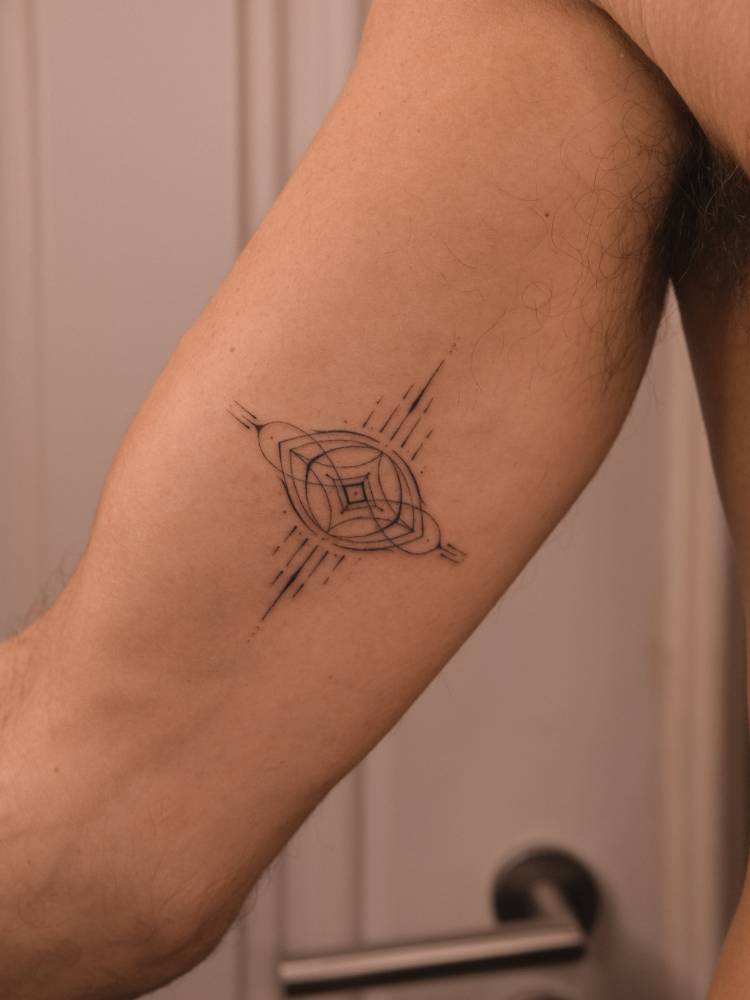 Hand poked ornamental design tattooed on the inner arm.