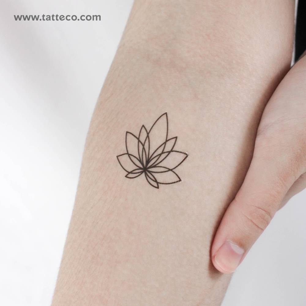 Line art lotus temporary tattoo located on the inner forearm.