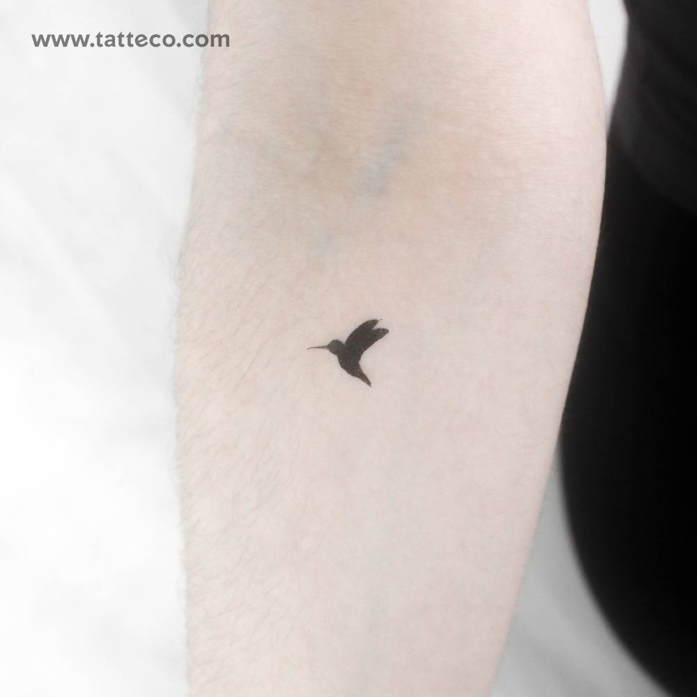 Blackwork hummingbird temporary tattoo placed on the inner forearm.