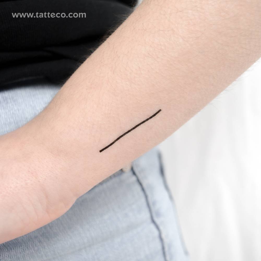 Minimalistic line temporary tattoo located on the wrist.