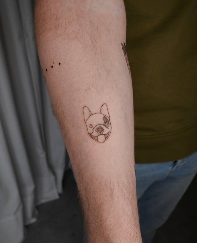 Minimalistic French Bulldog portrait tattoo located on the inner forearm.