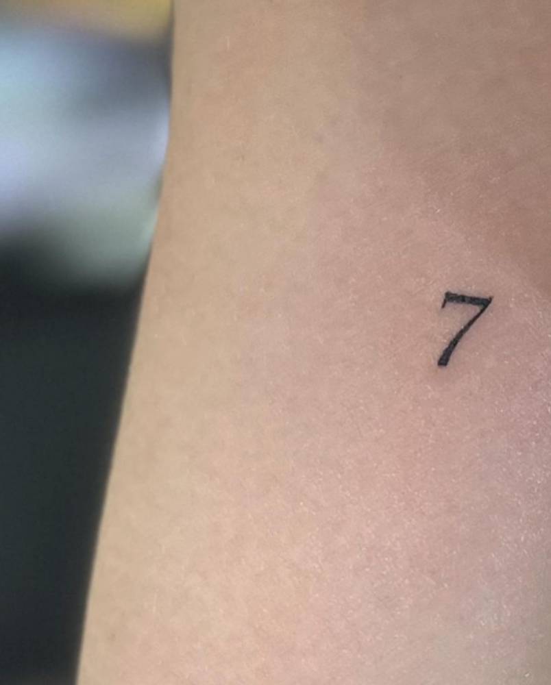 Tattoo of the number "7" done on the inner arm.