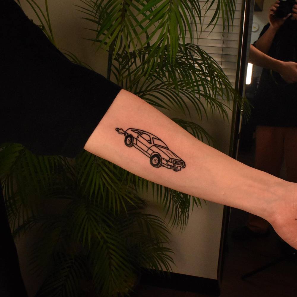 DeLorean tattoo located on the inner forearm.