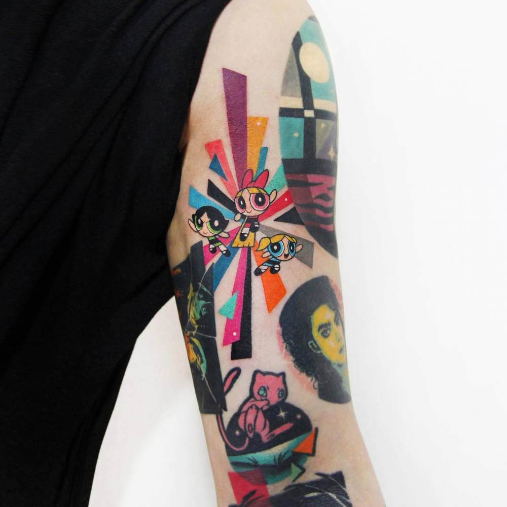 Powerpuff girls tattoo located on the tricep.