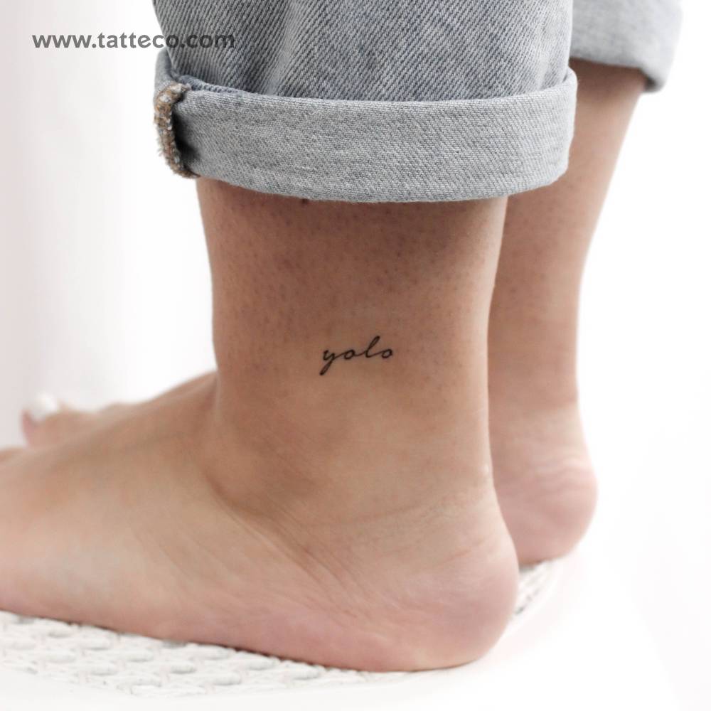 Yolo temporary tattoo on the ankle.