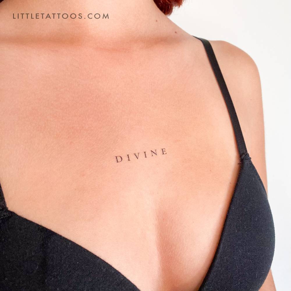 Uppercase serif "DIVINE" temporary tattoo on the chest.