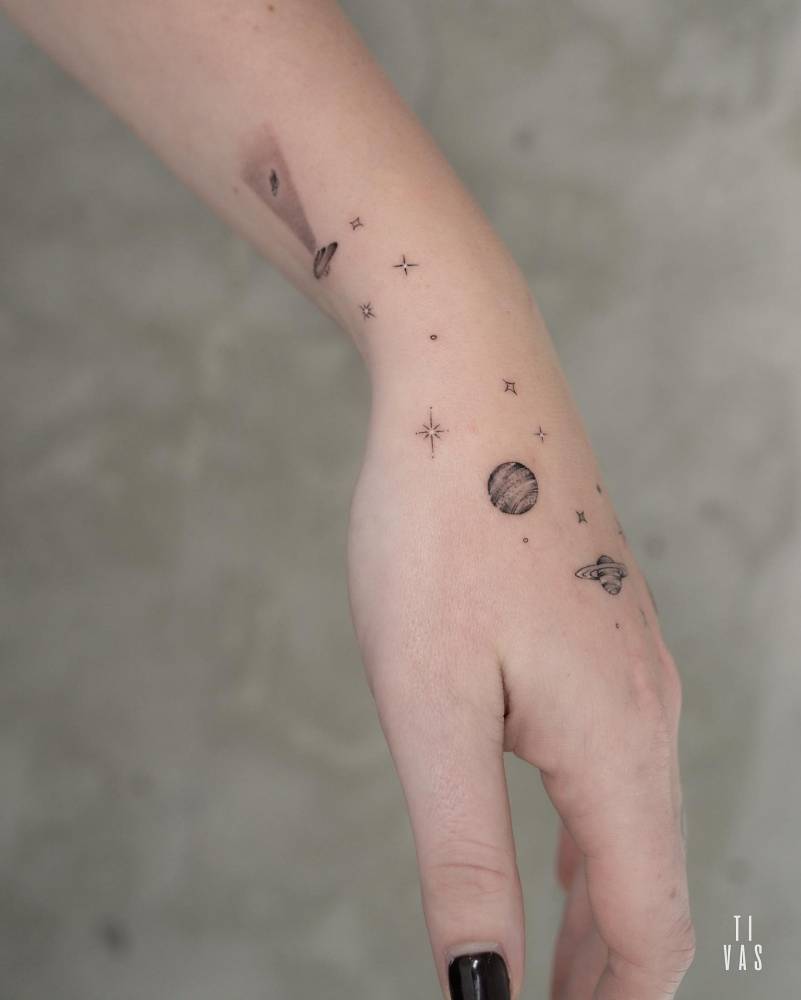 Galaxy tattoo located on the hand.