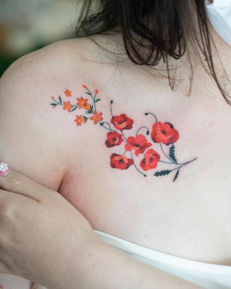 Poppy flowers tattooed on the chest.