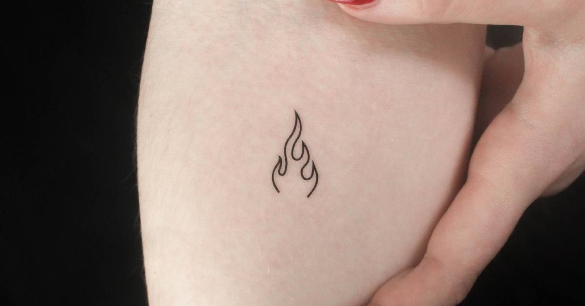 Minimalist flame temporary tattoo located on the inner