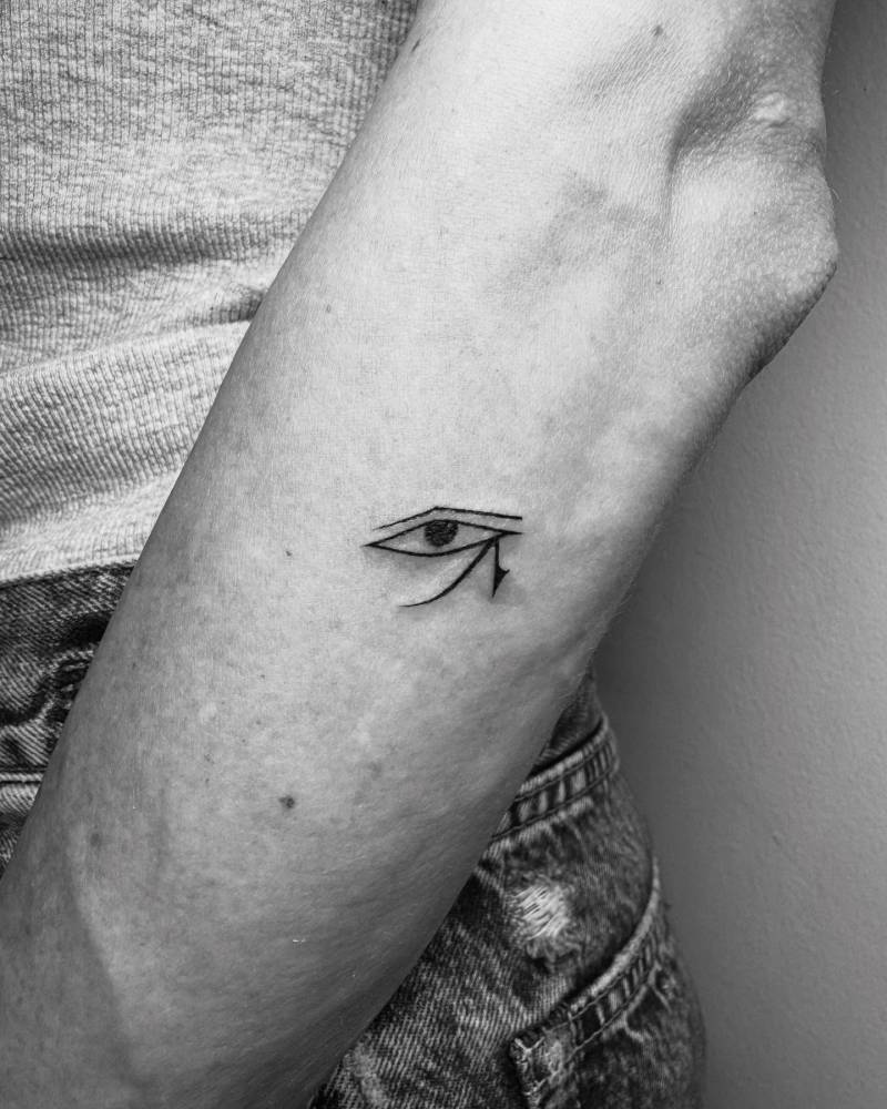 Eye of Ra tattoo in minimalistic style done on the forearm.