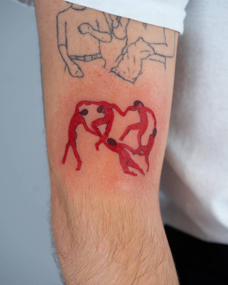 Matisse's 'Dance' tattoo located on the upper arm.