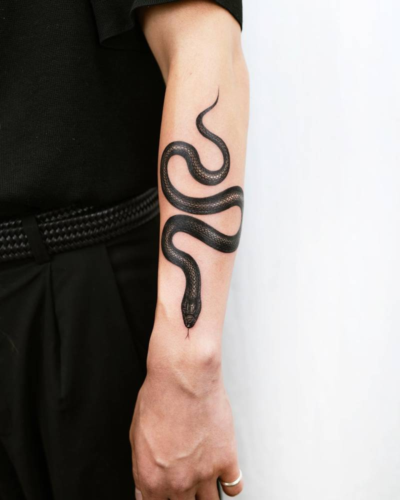 Micro-realistic style snake tattoo done on the forearm.