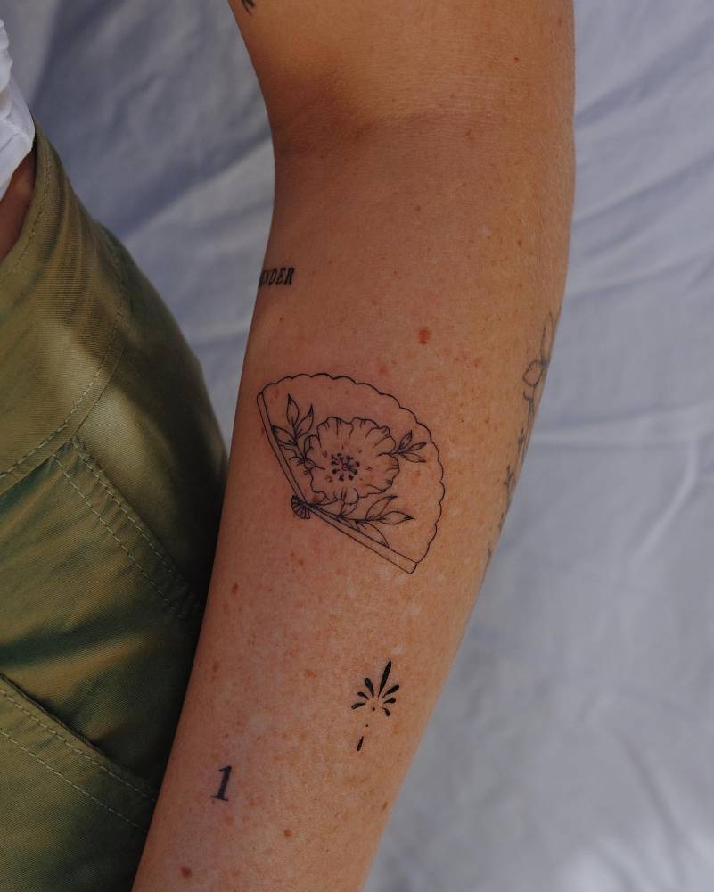 Forearm composition tattoos.