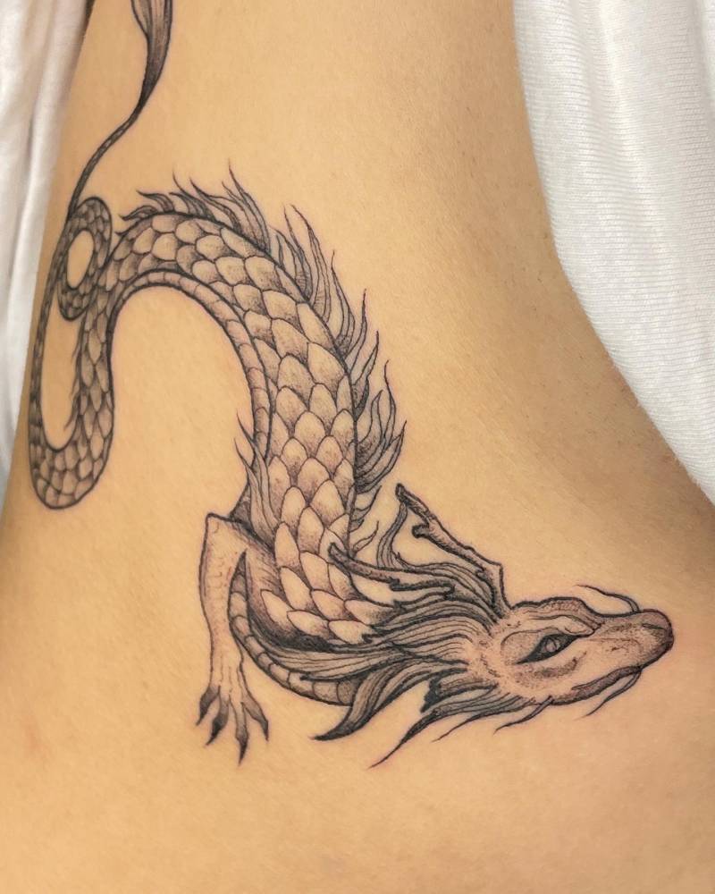 Dragon tattoo located on the rib.