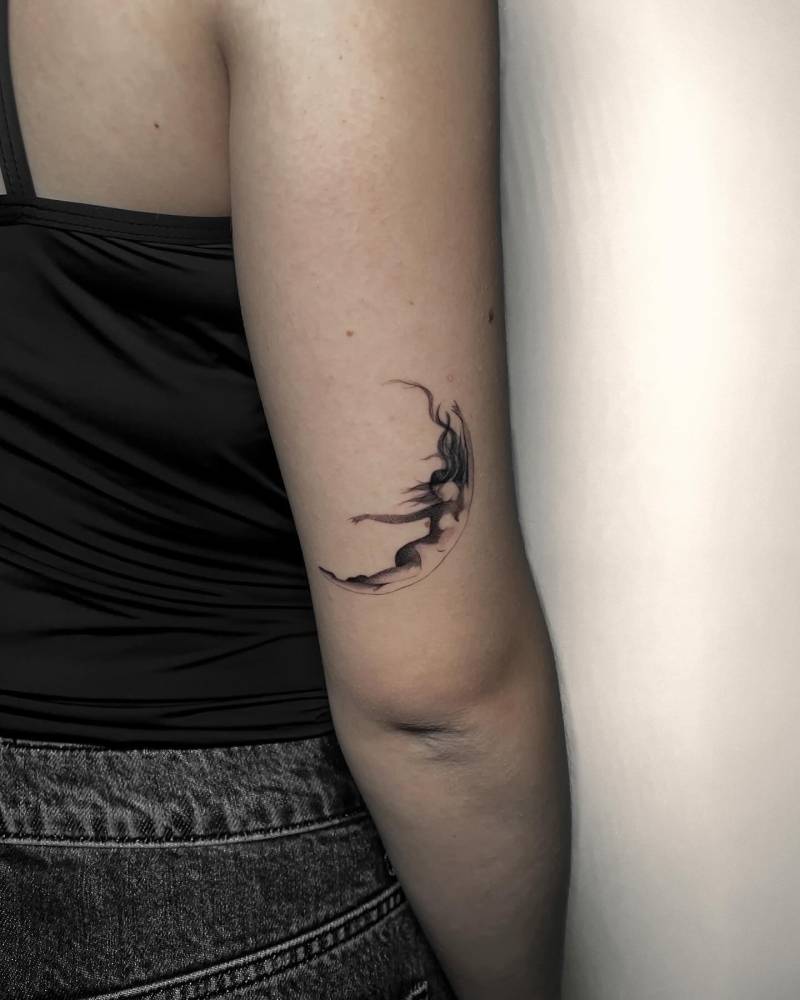 Crescent Lady tattoo located on the tricep.