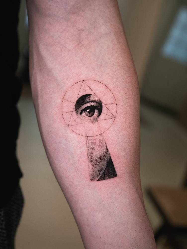 Fornasetti Tema e Variazioni 14 tattoo located on the inner forearm.