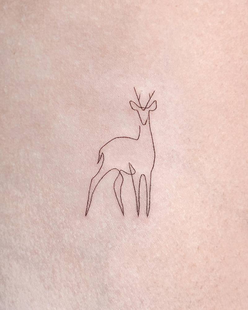 Fine line style deer tattoo located on the inner arm.