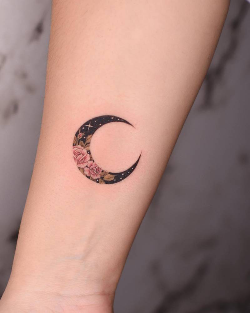 Flower moon tattoo located on the inner forearm.