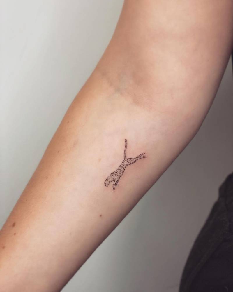 Running cheetah tattoo done on the inner forearm.