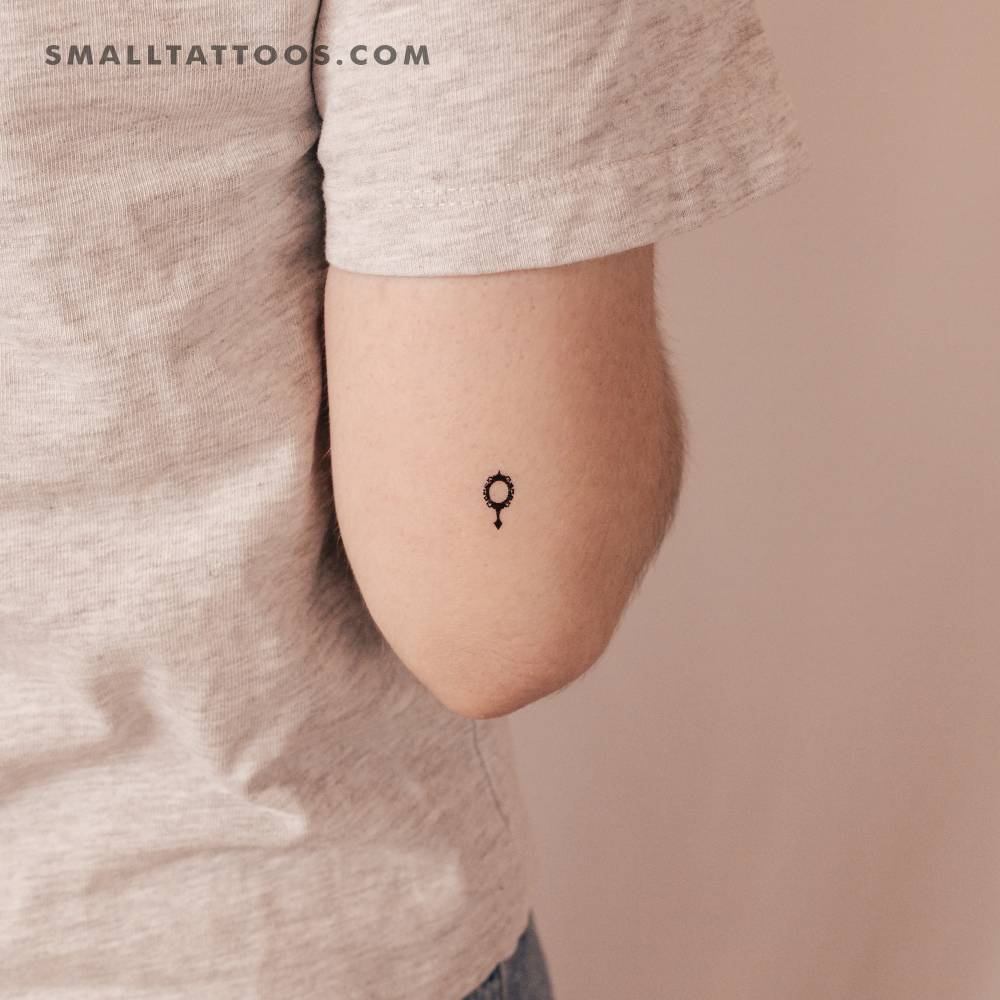 Mirror temporary tattoo in minimalistic style located on the tricep.