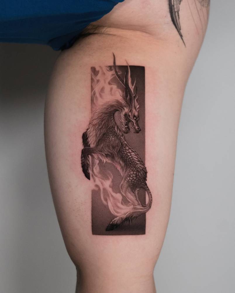 Micro-realistic style Kirin tattooed on the inner arm.