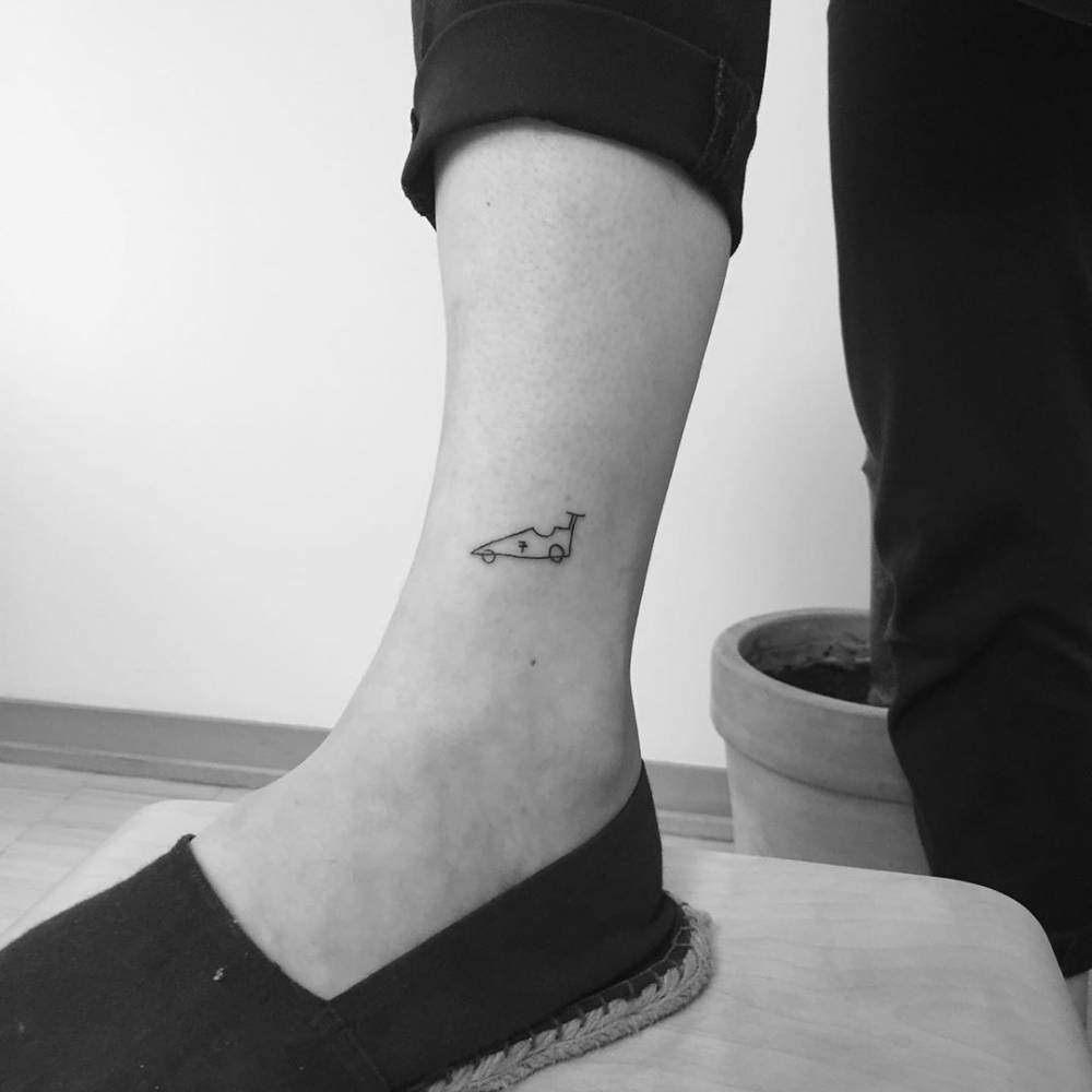 F1 car in ignorant style tattooed on the ankle.