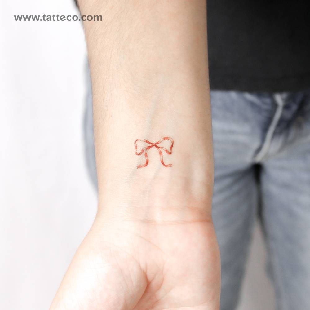 Red ribbon temporary tattoo located on the wrist.