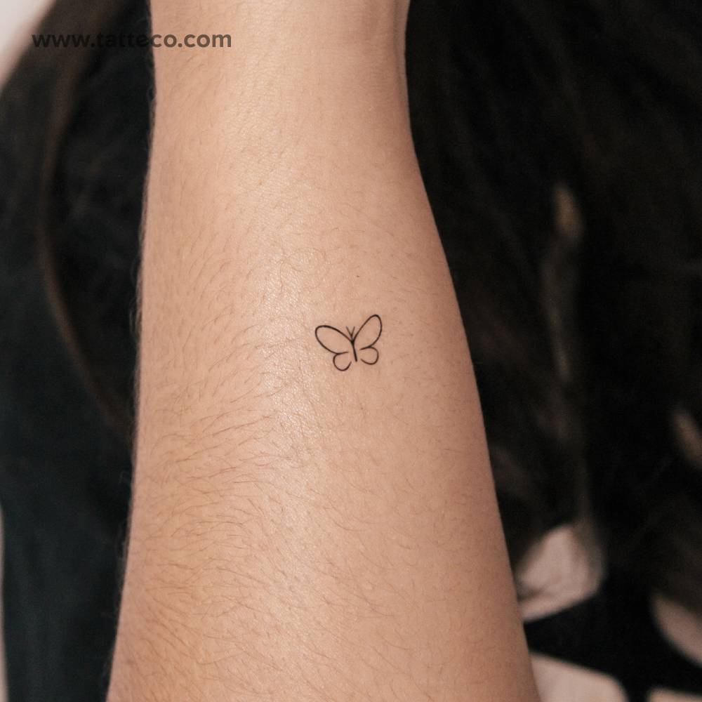 Minimal butterfly semi-permanent tattoo located on the wrist.
