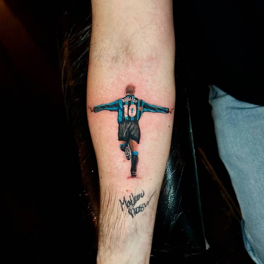 Ronaldo tattoo in micro-realistic style located on the inner forearm.