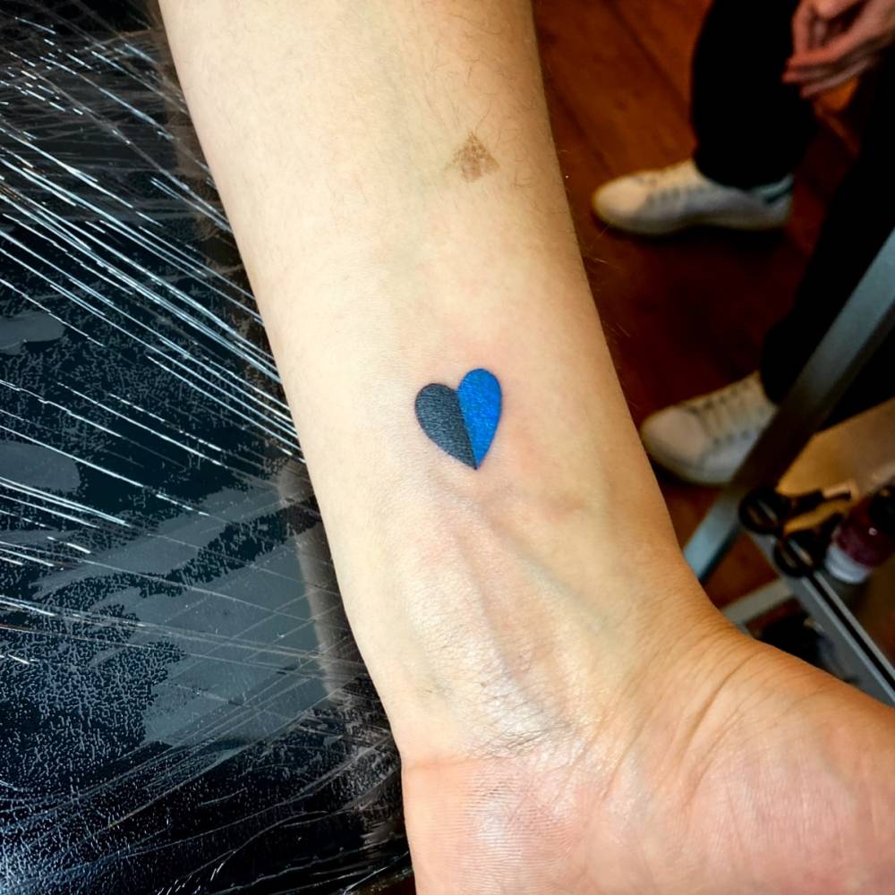 Inter Milan heart tattoo located on the wrist.