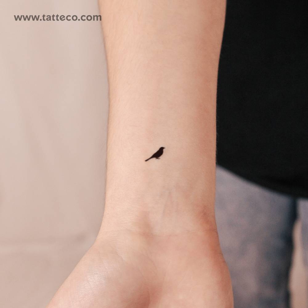 Standing bird 2-week temporary tattoo located on the wrist.