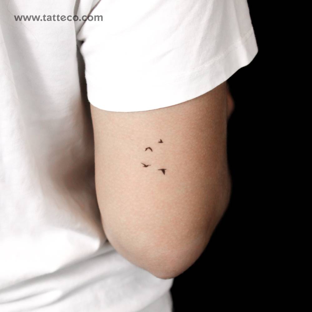 Minimalist flying birds semi-permanent tattoo done on the tricep.