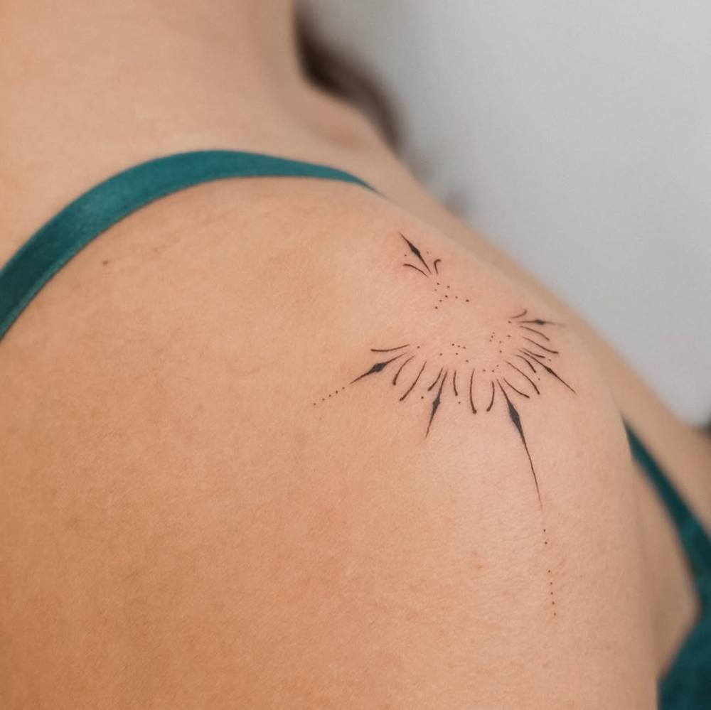 Ornamental design in fine line style located on the shoulder.