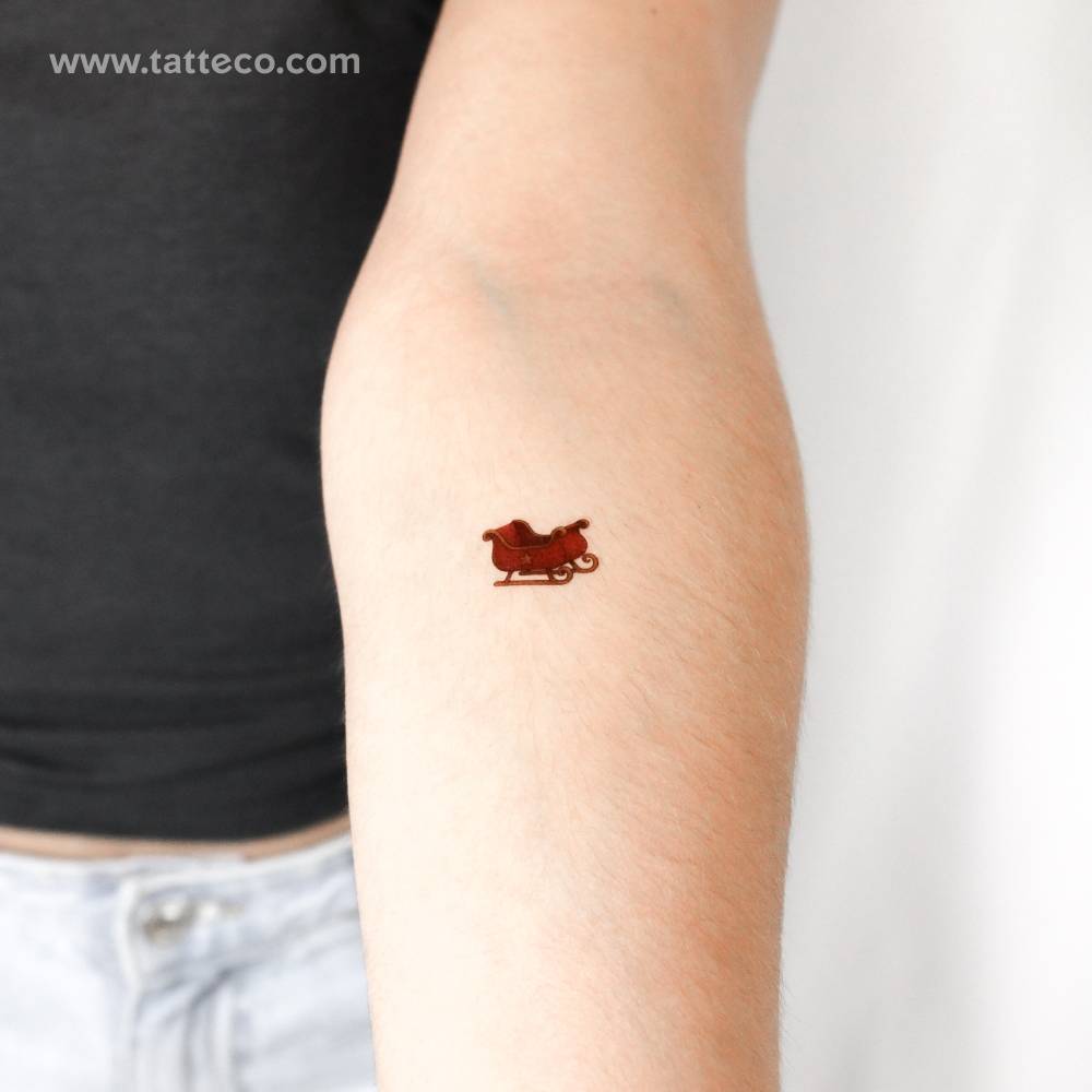 Sleigh temporary tattoo located on the inner forearm.