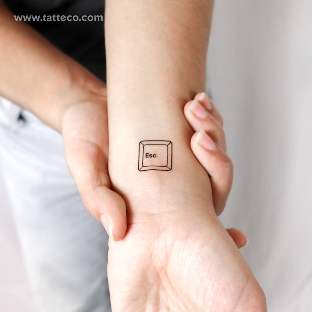 Escape key temporary tattoo located on the wrist.