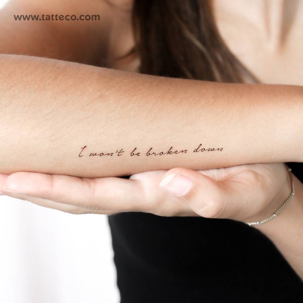 "I won't be broken down" temporary lettering tattoo.