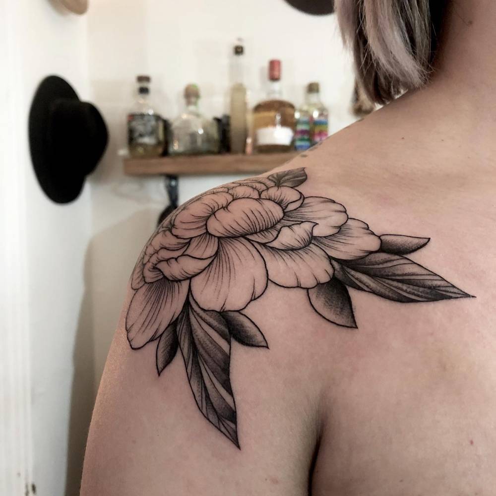 Peony tattoo done on the shoulder.
