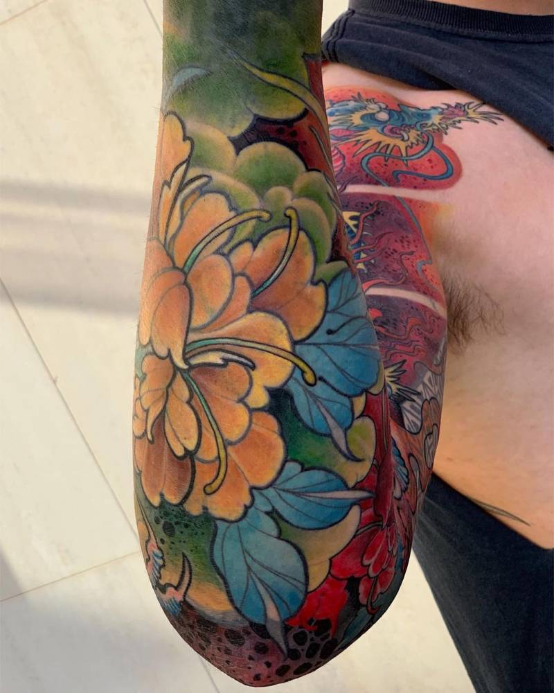 New school style peony tattoo on the forearm.