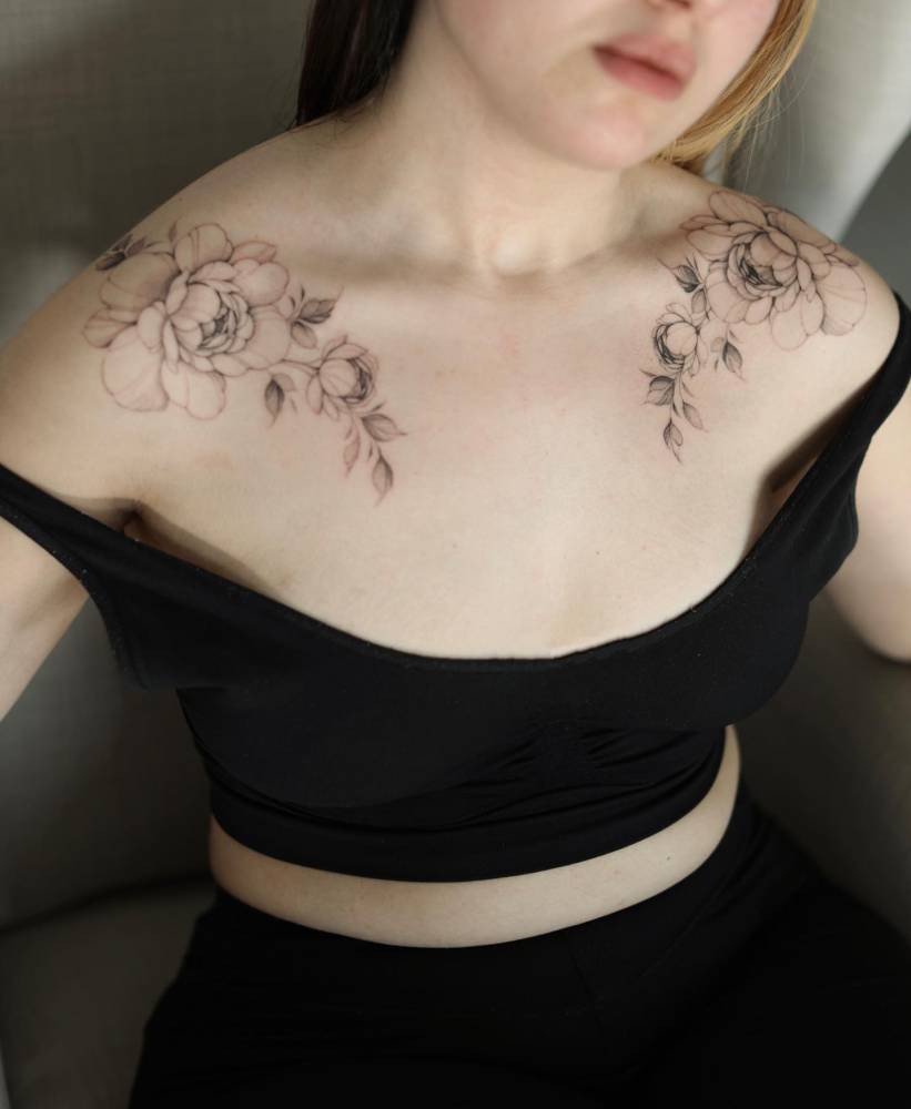 Individual matching peonies tattoo located on the collarbone.