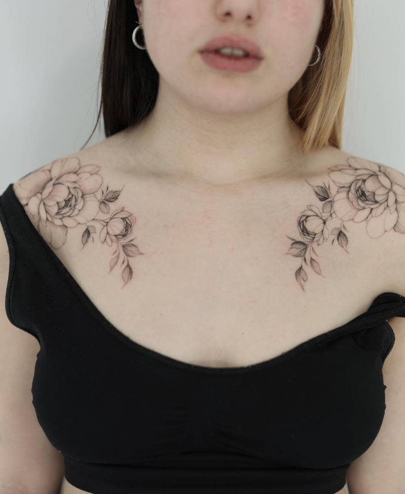 Individual matching peonies tattoo located on the collarbone.