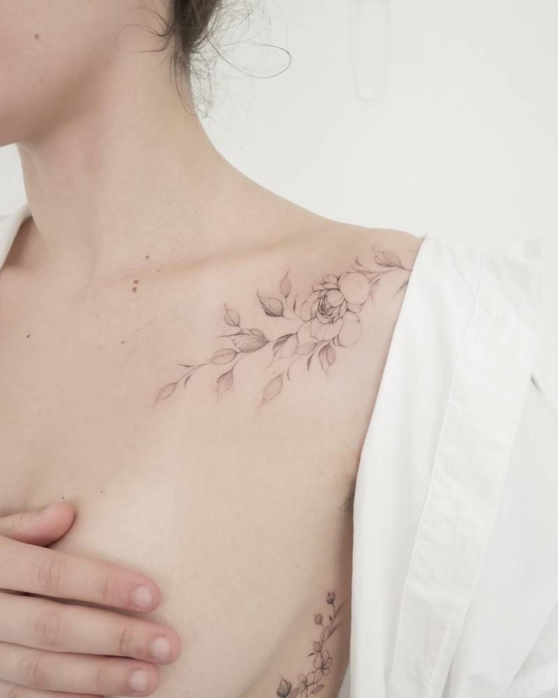 Illustrative style peony tattoo done on the collarbone.