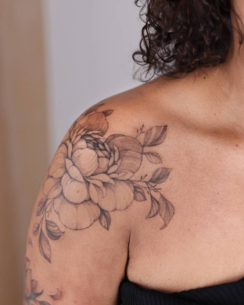 Freehand peony tattoo done on the shoulder.