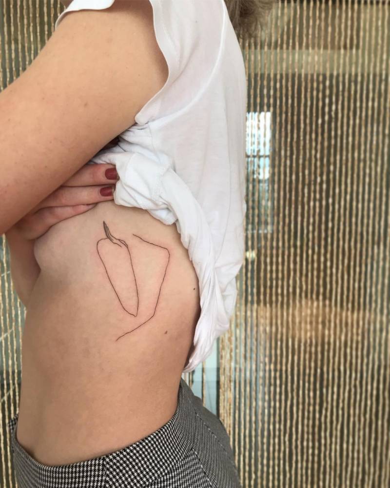 The wonderful work ‘Woman Waiting’ by Frederic Forest tattooed on the side boob.