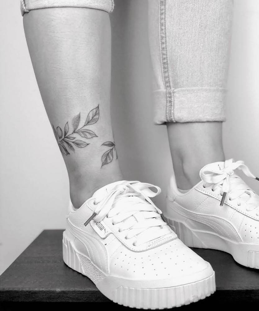 Flower anklet tattoo