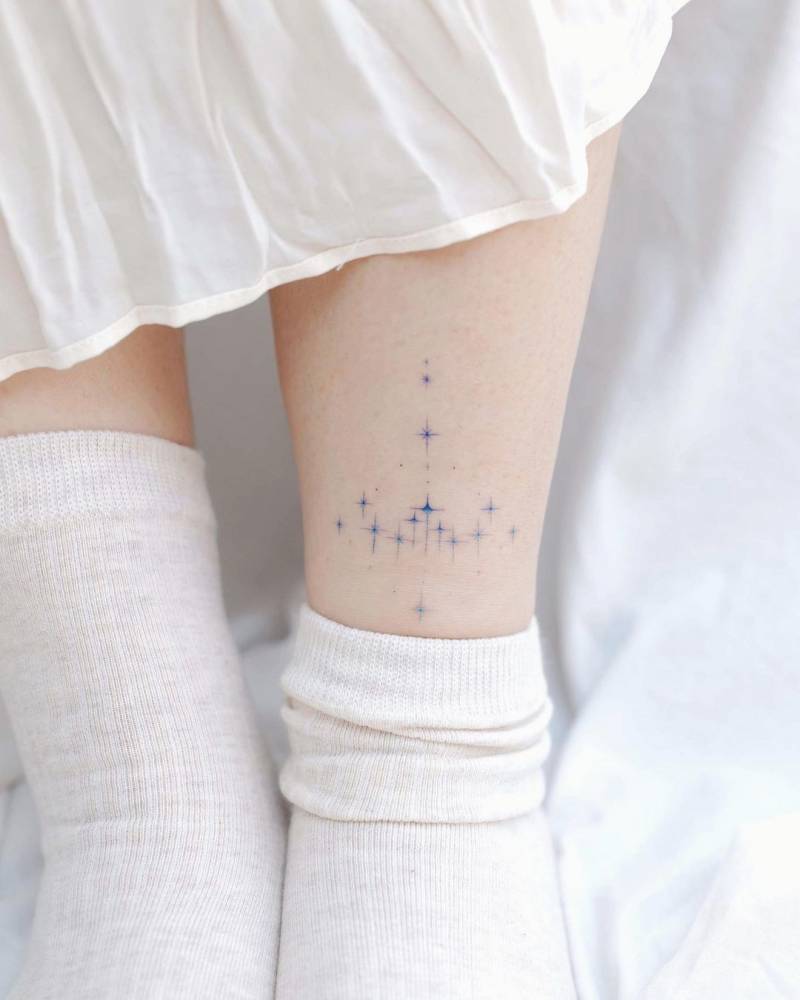 Stars tattooed on shin
