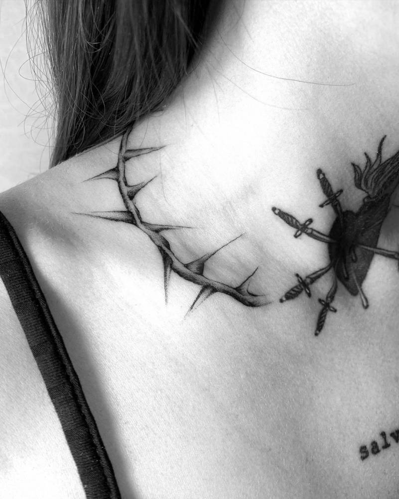 Flaming heart + thorns tattoo on the neck