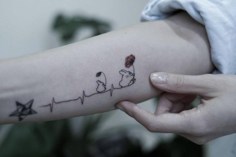 Chibi and Chuu Totoro heartbeat tattoo on the inner arm