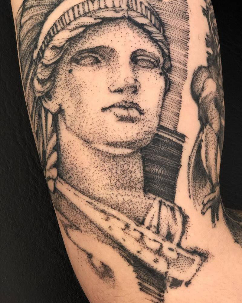 Sketch work Athena tattoo on the inner arm.