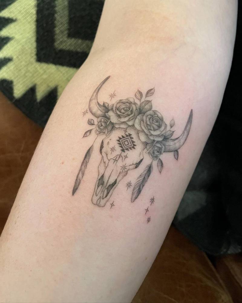 Taurus inspired bull skull tattoo on the inner forearm.