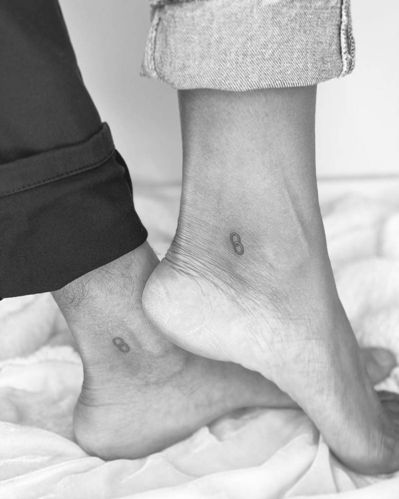 Minimalist matching chain tattoo for couple.